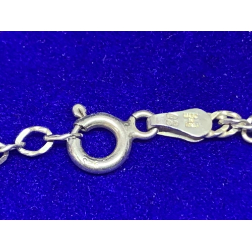 519 - A SILVER CHAIN AND PENDANT MARKED 925 WITH A PEARLISED TEARDROP DESIGN