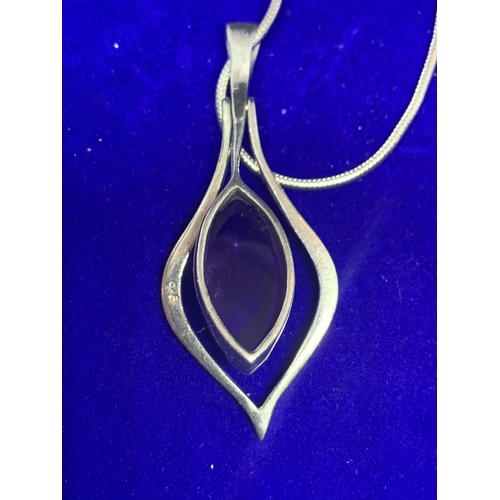 523 - A SILVER NECKLACE WITH PENDANT MARKED 925 WITH A PURPLE STONE WITH A PRESENTATION BOX