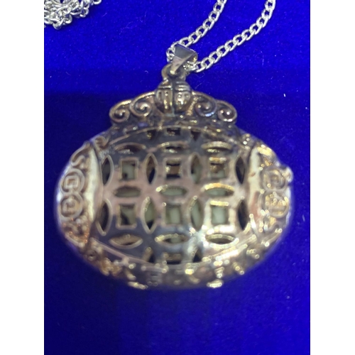 529 - A SILVER CHAIN MARKED STERLING AND AN ORNATE DOUBLE SIDED PENDANT WITH A PRESENTATION BOX