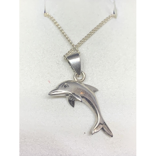 541 - A SILVER NECKLACE WITH A DOLPHIN PENDANT MARKED 925 IN A PRESENTATION BOX