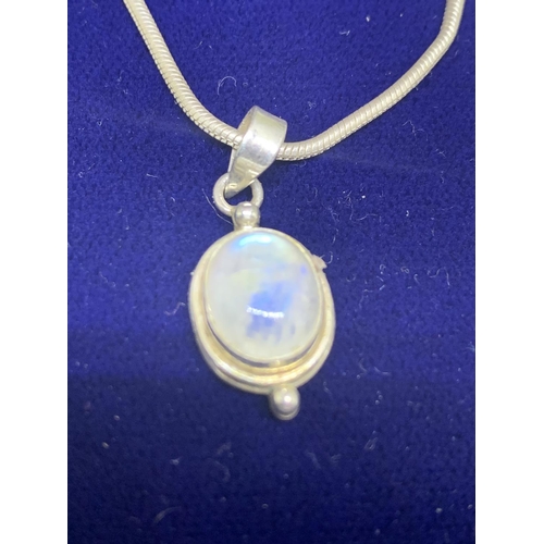 547 - A BOXED NECKLACE WITH AN OPAQUE STONE SET IN A SILVER PENDANT WITH MATCHING EARRINGS ALL MARKED 925 ... 