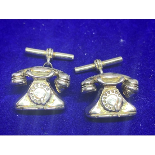 551 - A PAIR OF HALLMARKED SILVER TELEPHONE STYLE CUFF LINKS IN A PRESENTATION BOX