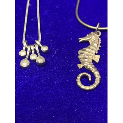 554 - FOUR ASSORTED SILVER NECKLACES MARKED 925 TO INCLUDE A DRAGONFLY AND SEAHORSE PENDANTS ETC