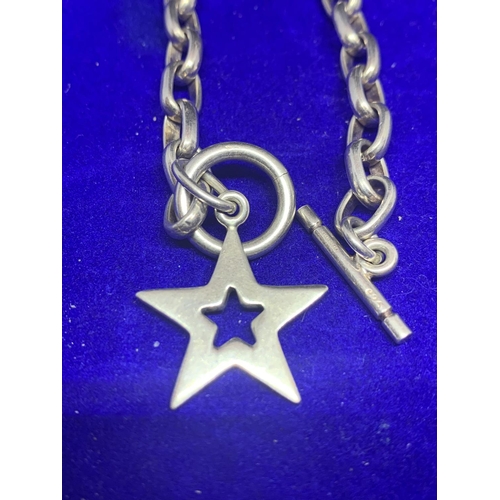 556 - TWO SILVER BRACELETS MARKED 925 TO INCLUDE A STAR DESIGN