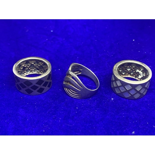 573 - THREE HEAVY SILVER RINGS