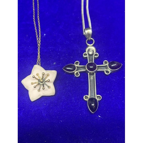 574 - FOUR ASSORTED SILVER NECKLACES MARKED 925 AND STERLING WITH CROSS, FLOWER, HEART AND DROP PENDANTS