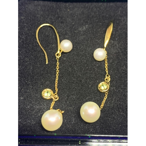 577 - A PAIR OF 9 CARAT GOLD DROP EARRINGS WITH PEARL AND STONE DESIGN IN A PRESENTATION BOX