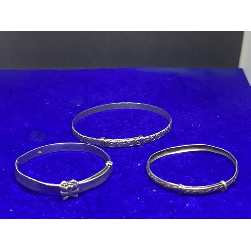 578 - FIVE VARIOUS SIZED SILVER BANGLES