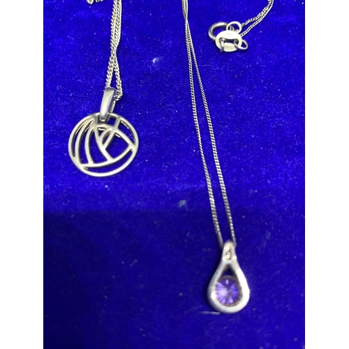 604 - FOUR ASSORTED SILVER NECKLACES WITH PENDANTS TO INCLUDE STONE AND ST CHRISTOPHER