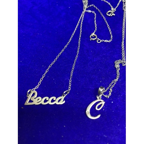 613 - FOUR SILVER NECKLACES TO INCLUDE A BECCA, L AND C PENDANT