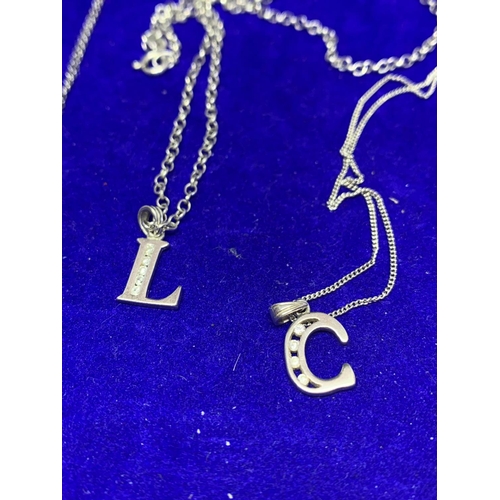 613 - FOUR SILVER NECKLACES TO INCLUDE A BECCA, L AND C PENDANT