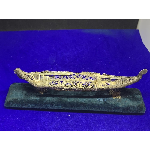 620 - AN ORNATE ASIAN WHITE METAL BOAT