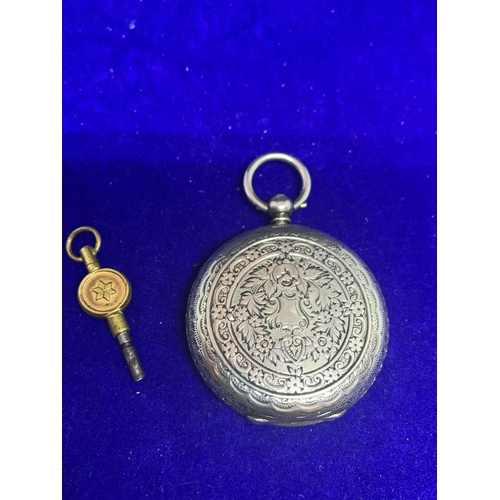 629 - AN ORNATE LADIES SILVER FOB WATCH WITH KEY