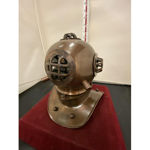 21 - AN ORNAMENTAL COPPER DIVER'S HELMET