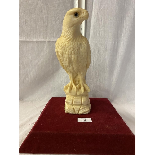 4 - A RESIN FIGURE OF A BIRD OF PREY - HEIGHT 28CMS