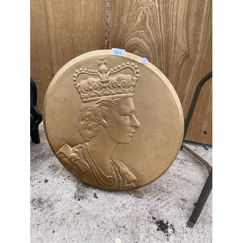 1213 - A WOODEN PLAQUE DEPICITING THE QUEENS HEAD COMPLETE WITH STAND