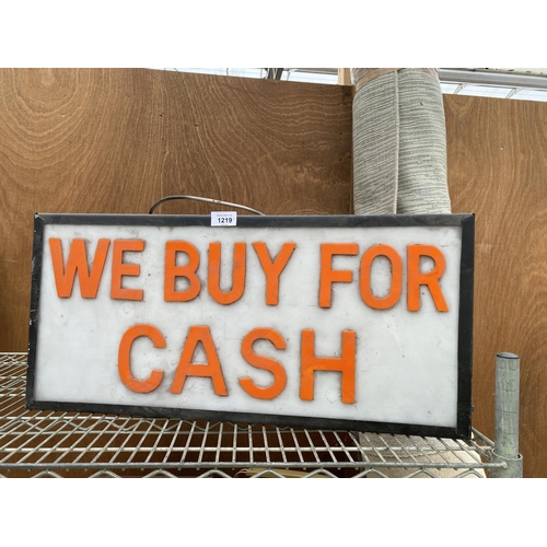 1219 - AN ILLUMINATED 'WE BUY FOR CASH' SIGN