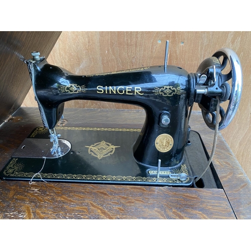 1252 - A VINTAGE SINGER SEWING MACHINE COMPLETE WITH CASE AND ORIGINAL FOOT PEDDLE AND INSTRUCTION MANUAL