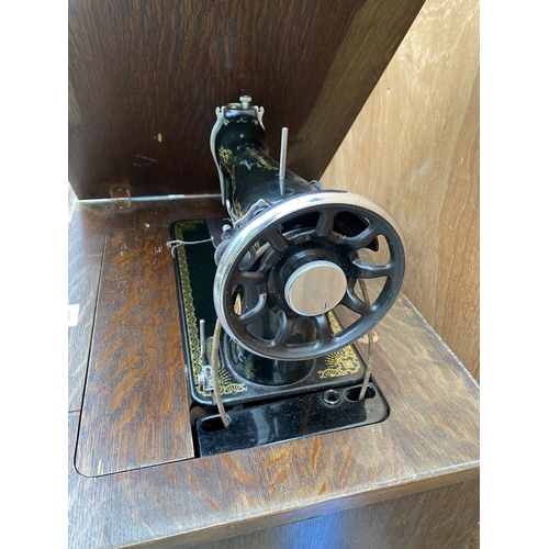 1252 - A VINTAGE SINGER SEWING MACHINE COMPLETE WITH CASE AND ORIGINAL FOOT PEDDLE AND INSTRUCTION MANUAL