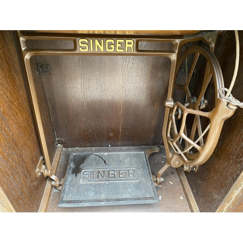 1252 - A VINTAGE SINGER SEWING MACHINE COMPLETE WITH CASE AND ORIGINAL FOOT PEDDLE AND INSTRUCTION MANUAL