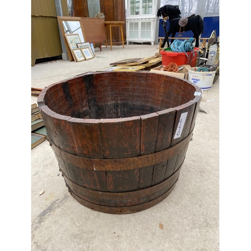 1265 - A LARGE HALF BARREL PLANTER