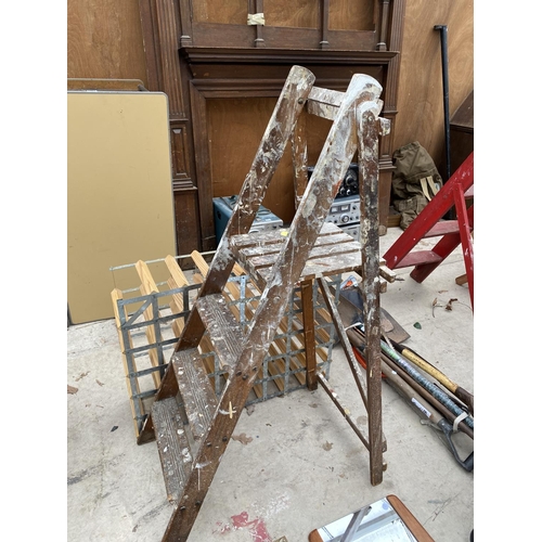 1266 - A SET OF VINTAGE WOODEN STEP LADDERS AND A WINE RACK