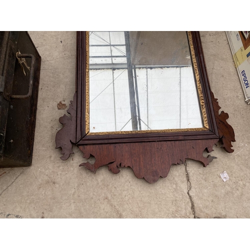 1279 - AN ORNATE AND CRAVED WOODEN FRAMED MIRROR