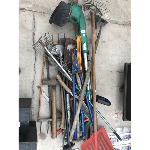 1295 - A LARGE QUANTITY OF GARDEN TOOLS TO INCLUDE AN ELECTRIC STRIMMER, RAKES, PRUNES AND SHEARS ETC