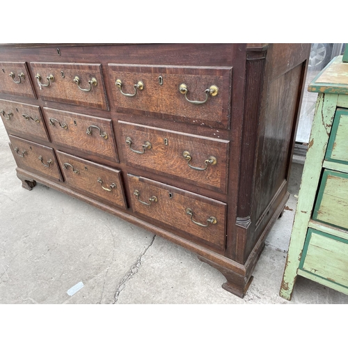 1901 - A GEORGE III OAK AND CROSSBANDED LANCASHIRE CHEST WITH FOUR SHAM DRAWERS, TWO BASE DRAWERS, ON OGEE ... 