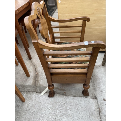 1908 - AN EARLY 20TH CENTURY WALNUT FRAMED LOW ELBOW CHAIR ON TURNED BULBOUS LEGS AND SCROLL FEET