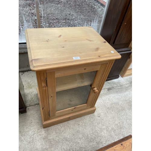 1911 - A MODERN PINE CABINET WITH GLAZED DOOR, 22