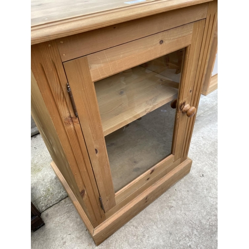 1911 - A MODERN PINE CABINET WITH GLAZED DOOR, 22