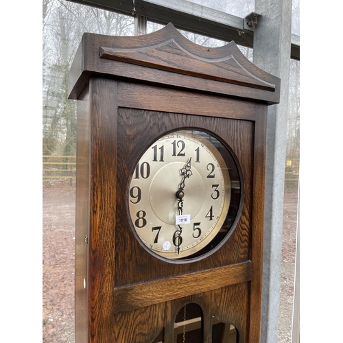 1916 - AN EARLY 20TH CENTURY OAK HALL LONGCASE CLOCK WITH GLASS DOOR AND THREE WEIGHTS