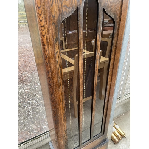 1916 - AN EARLY 20TH CENTURY OAK HALL LONGCASE CLOCK WITH GLASS DOOR AND THREE WEIGHTS