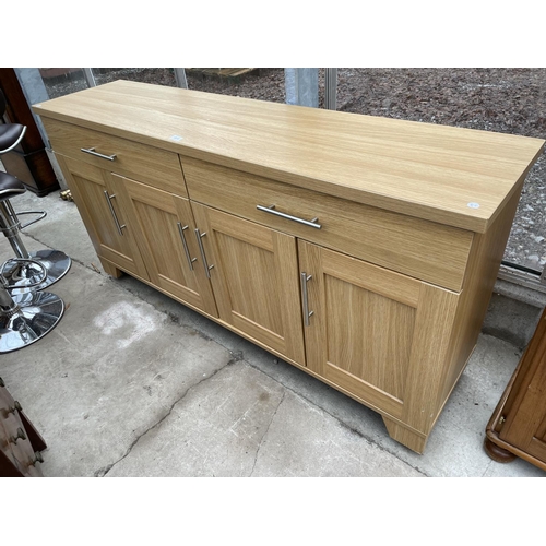 1918 - A MODERN LIGHT OAK EFFECT SIDEBOARD ENCLOSING TWO DRAWERS AND FOUR CUPBOARDS, 64