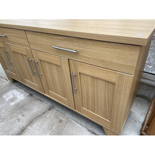 1918 - A MODERN LIGHT OAK EFFECT SIDEBOARD ENCLOSING TWO DRAWERS AND FOUR CUPBOARDS, 64