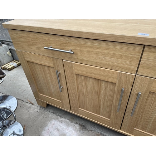 1918 - A MODERN LIGHT OAK EFFECT SIDEBOARD ENCLOSING TWO DRAWERS AND FOUR CUPBOARDS, 64