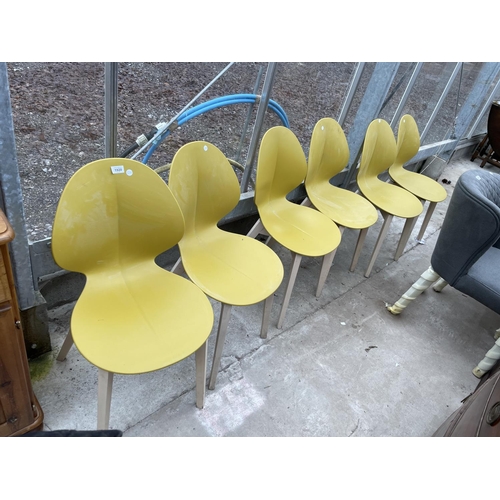 1920 - A SET OF SIX CALLIGNARIS CHAIRS WITH POLYCARBONATE ALL IN ONE SHAPED SEAT AND BACK ON WOODEN BASES