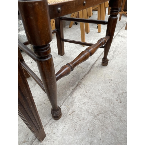 1934 - AN 18TH CENTURY STYLE LADDERBACK RUSH SEATED ELBOW CHAIR