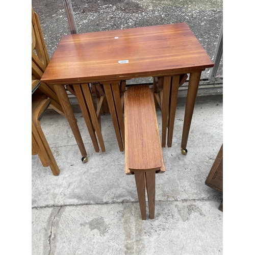 1936 - A RETRO TEAK NEST OF FIVE TABLES, FOUR BEING DROP-LEAF