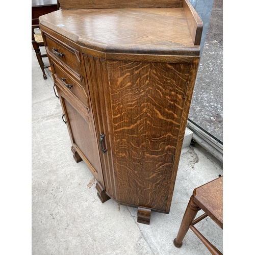 1937 - AN EARLY 20TH CENTURY OAK CORNER CABINET ENCLOSING THREE CUPBOARDS AND TWO DRAWERS, 42