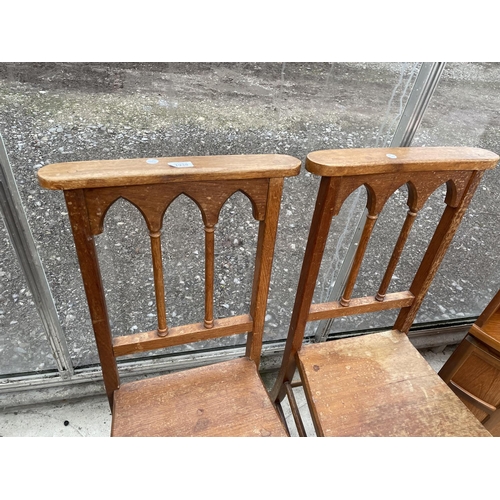 1938 - A PAIR OF VICTORIAN OAK HALL CHAIRS WITH GOTHIC STYLE BACKS