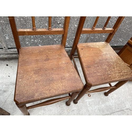 1938 - A PAIR OF VICTORIAN OAK HALL CHAIRS WITH GOTHIC STYLE BACKS