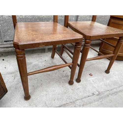 1938 - A PAIR OF VICTORIAN OAK HALL CHAIRS WITH GOTHIC STYLE BACKS