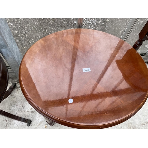 1943 - A MODERN CIRCULAR OCCASIONAL TABLE ON REEDED LEGS, 23