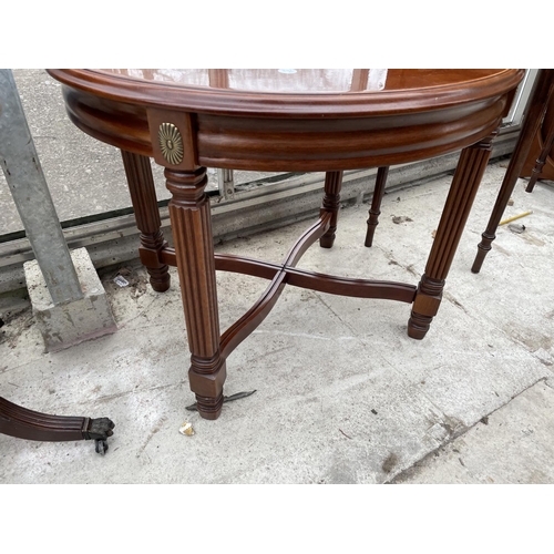 1943 - A MODERN CIRCULAR OCCASIONAL TABLE ON REEDED LEGS, 23