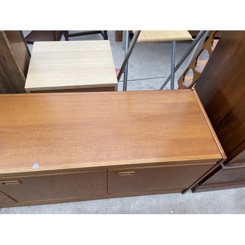 1955 - A RETRO JENTIQUE TEAK SIDEBAORD ENCLOSING THREE DRAWERS AND THREE CUPBOARDS