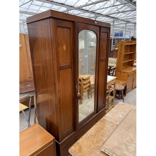 1956 - AN INLAID MAHOGANY WARDROBE WITH BEVEL EDGE MIRRORED DOOR AND LOWER DRAWER