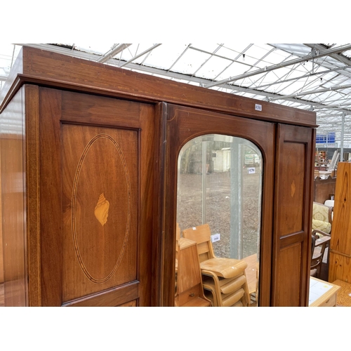 1956 - AN INLAID MAHOGANY WARDROBE WITH BEVEL EDGE MIRRORED DOOR AND LOWER DRAWER