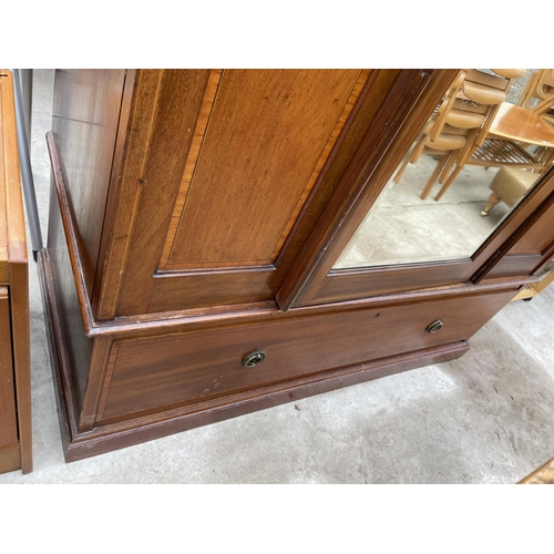 1956 - AN INLAID MAHOGANY WARDROBE WITH BEVEL EDGE MIRRORED DOOR AND LOWER DRAWER